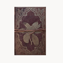Decorative notebook with floral design and brown string on a white background