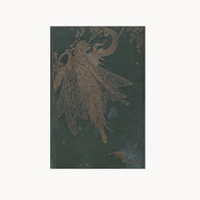 Book with a decorative cover featuring a stylized tree design on a dark green background