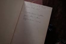 Handwritten notes inside a book with a dark background