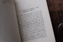 Open book with text on a wooden surface