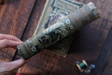 Decorative book with intricate designs on a wooden surface