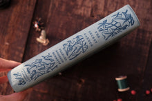 Product packaging with decorative design on a wooden surface