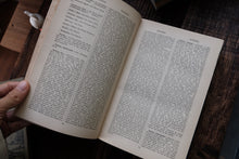 Inside pages of a book on a wooden surface
