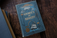 Book titled 'Stories of Bravery' with decorative cover on a wooden surface
