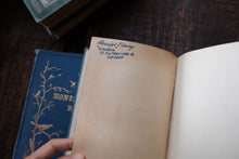 Open book with handwritten notes on a wooden surface