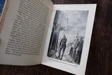 Open book with a illustration on a wooden surface