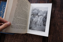 Open book with a illustration on a wooden surface