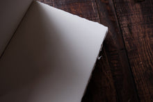 White paper on a wooden surface