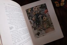 An open book with printed text on the left page and a vintage-style floral illustration on the right page, photographed on a dark wooden surface with a butterfly visible in the corner.