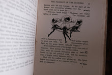 An open book showing a printed page from 'The Pageant of the Flowers' with a black-and-white floral illustration and text, photographed against a dark background.